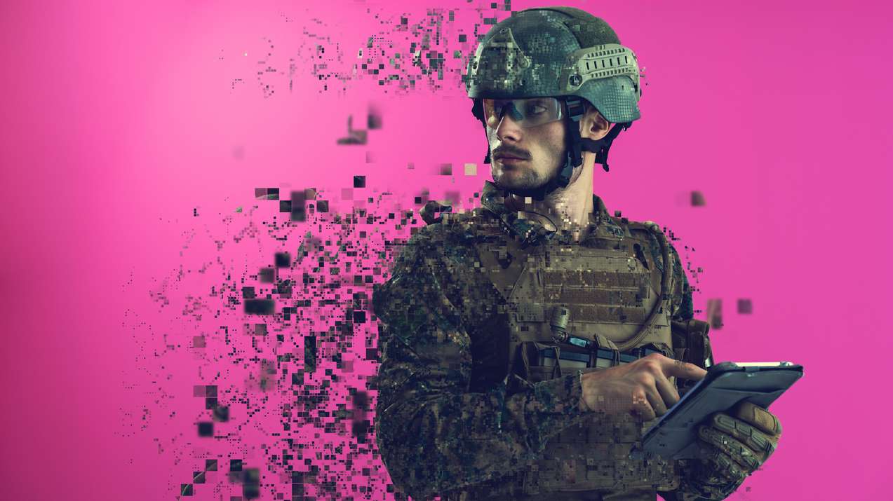 soldier using tablet computer closeup pixelated